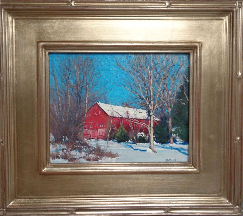 Painting in a gold frame of a red barn with trees and snow by Michael Budden. Sold by Maser Galleries.